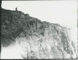 Image: Duck Hawk Cliff, MacMIllan in nest, Oscar with Gun